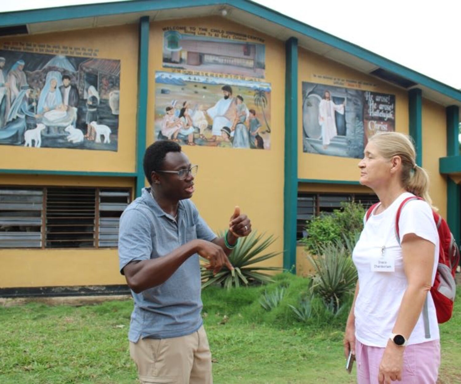 Guy talking to woman.
