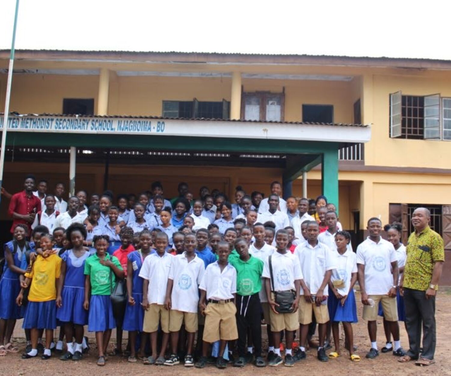 School children standing in front of UMC secondary school in Bo