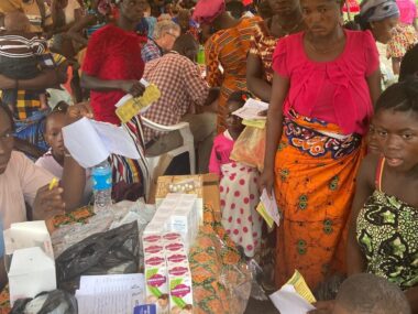 PHOTO-2024-07-10-07-43-31 (1) The village of Fengehun gathered for care under tent.