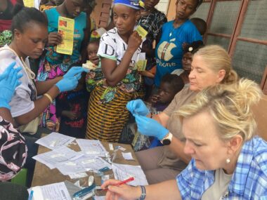 PHOTO-2024-07-10-07-43-32 Rev. Gina providing medical care to the Fengehun villiage.