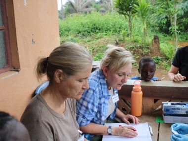 PHOTO-2024-07-10-12-20-38 Rev. Gina reading paper to Fengehun Villager